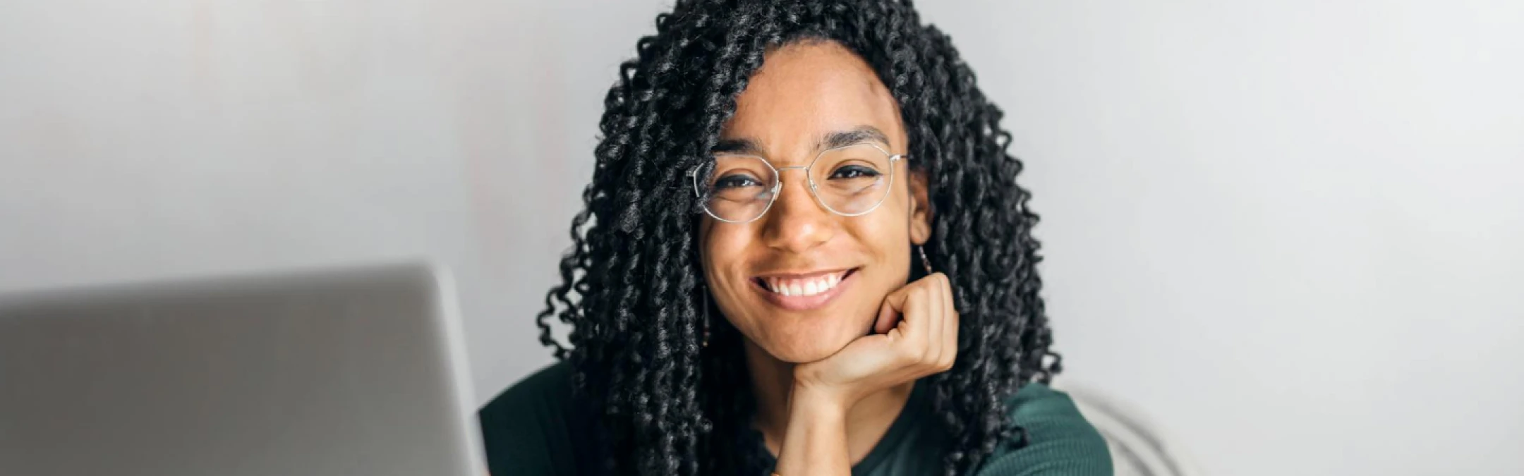 A futuristic classroom with AI-powered learning tools, virtual reality education, and students engaging with interactive digital content